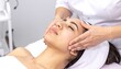 © WutStock02 - A serene woman relaxes as a skilled therapist gently massages her face at a tranquil spa, surrounded by soft lighting and calming decor.