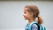© MiguelAngel - Smiling pupil wearing backpack going back to school: elementary education concept