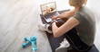 © Prostock-studio - Senior woman watching online video sports tutorial on laptop, taking break from her domestic training. Mature lady communicating to her personal trainer on web at home, copy space