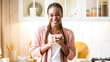 © Prostock-studio - Portraif Of Cheerful Black Woman Enjoying Morning Coffee In Kitchen, Happy Black Female With Dental Braces And Braids Holding Cup With Caffeine Drink And Smiling At Camera, Relaxing At Home