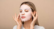 © Siti - Woman applying a sheet face mask skincare routine beauty treatment selfcare healthy skin glow facial mask cosmetics pampering