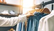 © Ninasarics - Customer browsing clothing rack in store