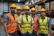 © Artem - Group of construction workers wearing safety helmets and reflective vests in a warehouse during daytime