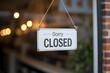 © Hriday - Closed Sign Announcement: A stark Closed sign hangs on a glass door, subtly communicating an announcement, hinting at absence and temporary closure in a clean, understated design.