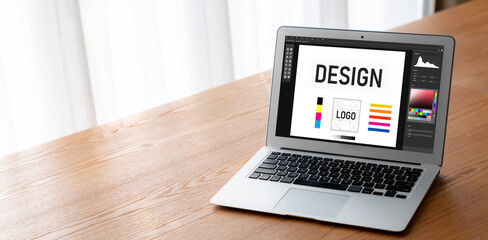Graphic designer software for modern design of web page and commercial ads showing on the computer screen