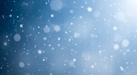 Soft focus blue background with falling snowflakes and bokeh lights
