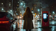 © VinakMotion - Charging station during nighttime. Woman standing at a charging station on a rainy night in a city, surrounded by illuminated buildings