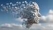 © sarun - Conceptual Image of a Human Face Made of Puzzle Pieces Disintegrating Against a Blue Sky with Clouds