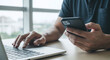 © ShalihStudio - Professional Man Multitasking with Laptop Smartphone for Digital Business Work