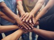 © ali - Diverse team hands stacked in unity, multiethnic group cooperation and solidarity, close-up of people joining hands for community support and partnership