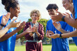 © Rido - Female coach encourages sport team before the game