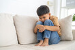 © Art_Photo - Young boy sitting with thoughtful expression, child feeling emotional sadness and sorrow, melancholic mood, childhood emotions, feeling lonely, introspection and reflection, grief and solitude