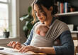 © Eira - Young mother working from home on her laptop with her sleeping baby in a sling carrier