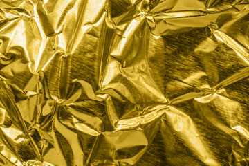 Wall Mural - luxury shiny metallic golden foil crumpled texture background