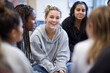 © Olha Havelia - Female youth group participating in self-care education session with instructor, seated in circle,
