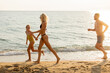 © BGStock72 - Family fun on the beach at sunset with laughter and joy in the air