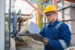© reewungjunerr - Petrochemical engineer working at petroleum oil refinery industry area. Industrial technician worker maintenance inspect manufacturing energy power gas system at factory.
