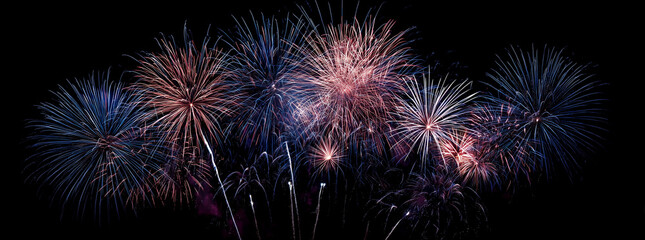 A fireworks display against the night sky. Colourful Fireworks, Abstract firework background with free space for text.