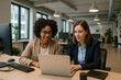 © Rinata - women working on a laptop in an office.