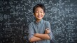 © Johannes - happy cheerful proud confident smiling cute asian schoolboy with arms crossed standing posing in classroom on chalkboard blackboard with formulas background elementary preteen school kid portrait no