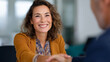 © Kateryna - Professional Female Executive Shaking Hands with Male Colleague in Office