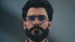 © Premium Resource - Portrait of man with beard and glasses looking at camera for male model fashion and style guide