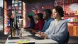 © DC Studio - Teamworking call center coworkers in office helping customers by answering questions. Team of agents in customer support workplace in front of PC using headset mic to talk with clients, camera B