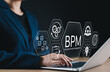 © Sandwish - BPM, Business Process Management Strategy Concept. Businessperson working on laptop with BPM technology icons, symbolizing workflow optimization, operations control, efficiency, process improvement,