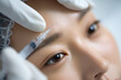 © Surachetsh - Japanese woman receiving cosmetic injection, with focus on beauty enhancement and advanced aesthetic procedures, modern beauty treatments and professional skincare.