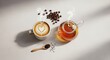 © Soleh - Delightful coffee latte with heart shaped foam art alongside aromatic herbal tea presentation