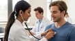 © Mey - A young woman in a white coat listens to a young man's heartbeat with a stethoscope in a medical office.