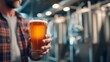 © HPMP Studio - Holding Pint of Beer in Brewery Setting Enjoying Beverage