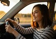 © Habibur - A happy young woman driving a car during golden hour