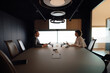 © Westend61 - Business team collaborating in a modern meeting room with technology