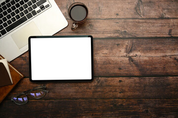 Wall Mural - top view of digital tablet with blank white screen on rustic wooden desk