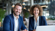 © Old Man Stocker - Professional Smiling Business Team in Modern Office Environment with Laptop and Natural Light