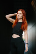© dsheremeta - Active woman with red hair exercising outdoors