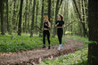 © dsheremeta - Women jogging on forest trail for fitness