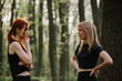 © dsheremeta - Two women talking during a break in forest training