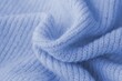 © Larysa - Knitted cashmere blue fabric texture with large fold