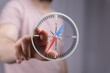 © vegefox.com - A person's finger interacts with a digital compass interface, showing direction and navigation.