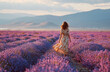 © aboutnuylove - Young woman in lavender field at sunset. Beautiful girl in long dress walking in lavender field
