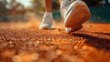 © Pat J. - a close-up shot of tennis shoes sliding on a clay court, dust particles visible, shallow depth of field