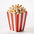 © ABD AITAMA - Classic Cinema Snack: A vibrant, close-up shot of a brimming box of popcorn. The popcorn is fluffy and golden, promising a delicious treat.