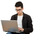 © Shahnaj - Young man wearing glasses focused on laptop screen typing on keyboard working on a project isolated on transparent background