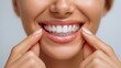 © NovaVision - Close-up of a woman smiling with invisible aligners for teeth straightening, showing off healthy teeth.