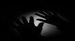 © yaka_std - Shadowy hands in darkness