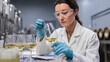 © Justlight - A wine researcher inspects fermentation samples in sterile laboratory setting calibrating chemical levels to perfect the final product.