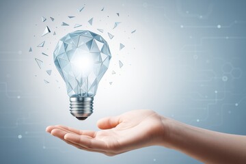 Wall Mural - hand holding glowing low-poly lightbulb with digital shards on tech-themed background symbolizing in