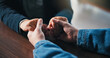 © peopleimages.com - Holding hands, table and couple in home for support, empathy and bonding for love. Relationship, counseling and above of people together for connection, affection and care for commitment in house
